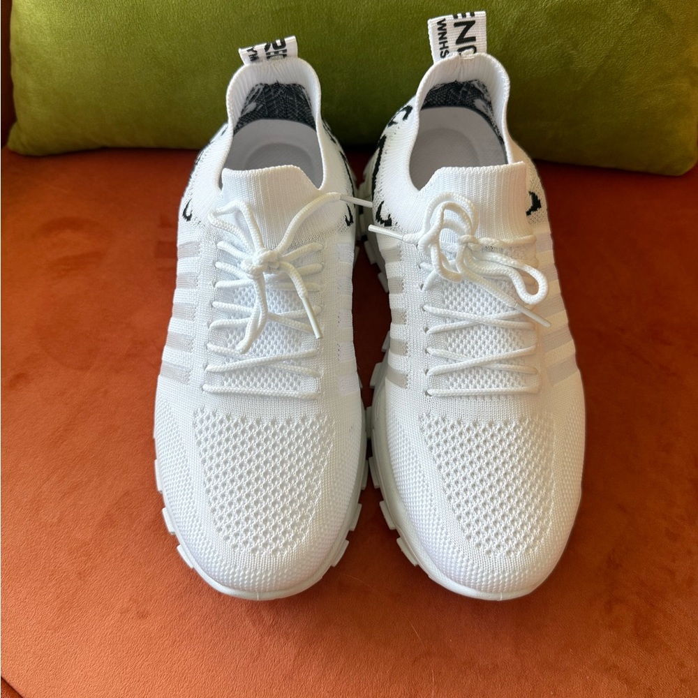 White and Black  Knit Sneakers. Very comfortable but are too big for me